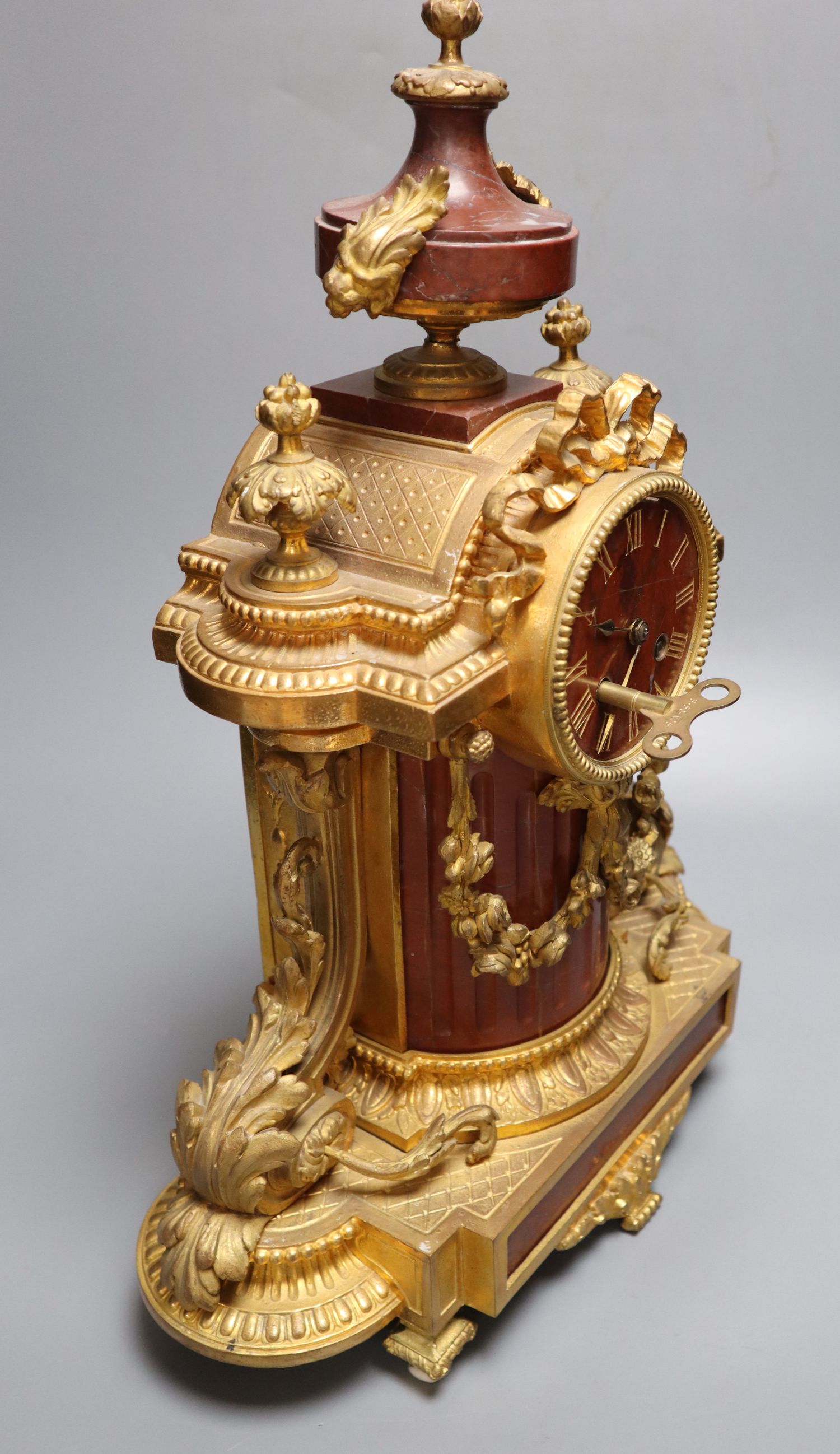 A French rouge marble and ormolu mantel clock, height 46cm
